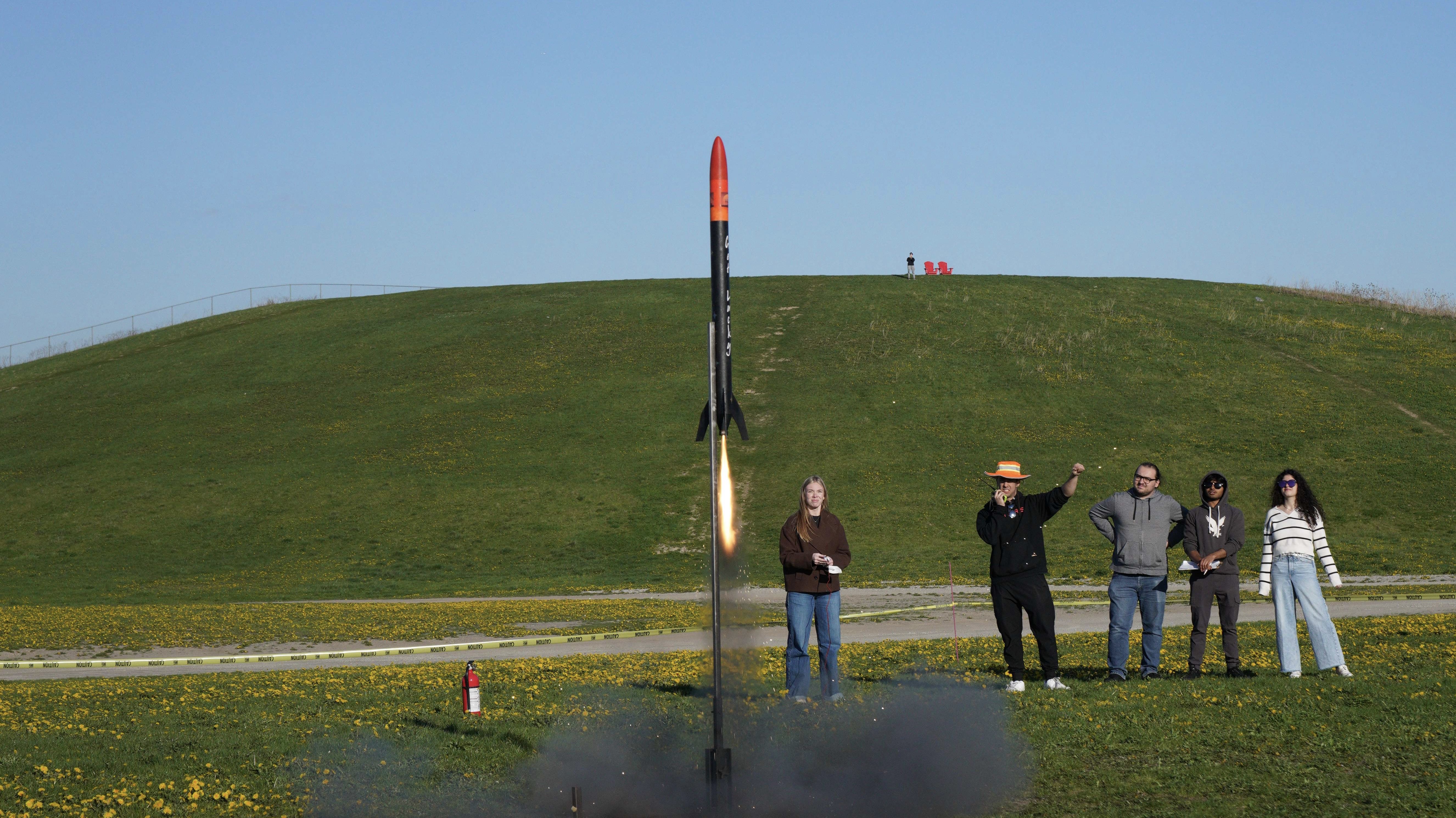 A MARS model rocket lifting off at a student launch